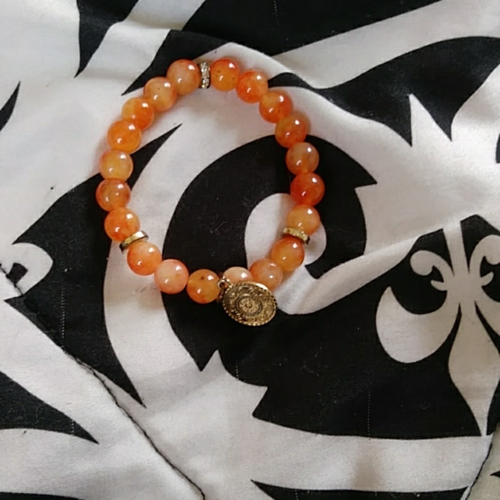 Women's orange pearl bracelet with pendant